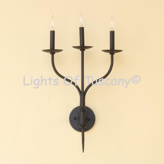 modern wrought iron wall sconce

3 light wall sconce

three light candle sconce

candelabra wall sconce

modern Spanish Revival lighting

Spanish Revival wall sconce

Mediterranean wall sconce

Tuscan style wall sconce

Old World iron wall